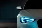 white vehicle with blue neon headlight bulb