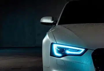 white vehicle with blue neon headlight bulb